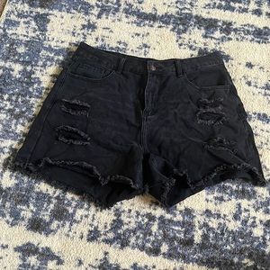 black ripped jean shorts
